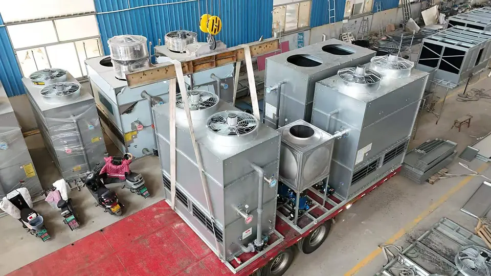 Multiple galvanized cooling tower units loaded on trailer before delivery