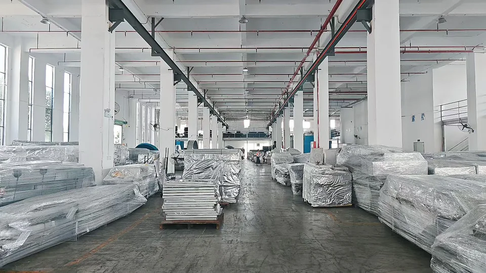 Wrapped cooling tower units staged inside a factory before dispatch